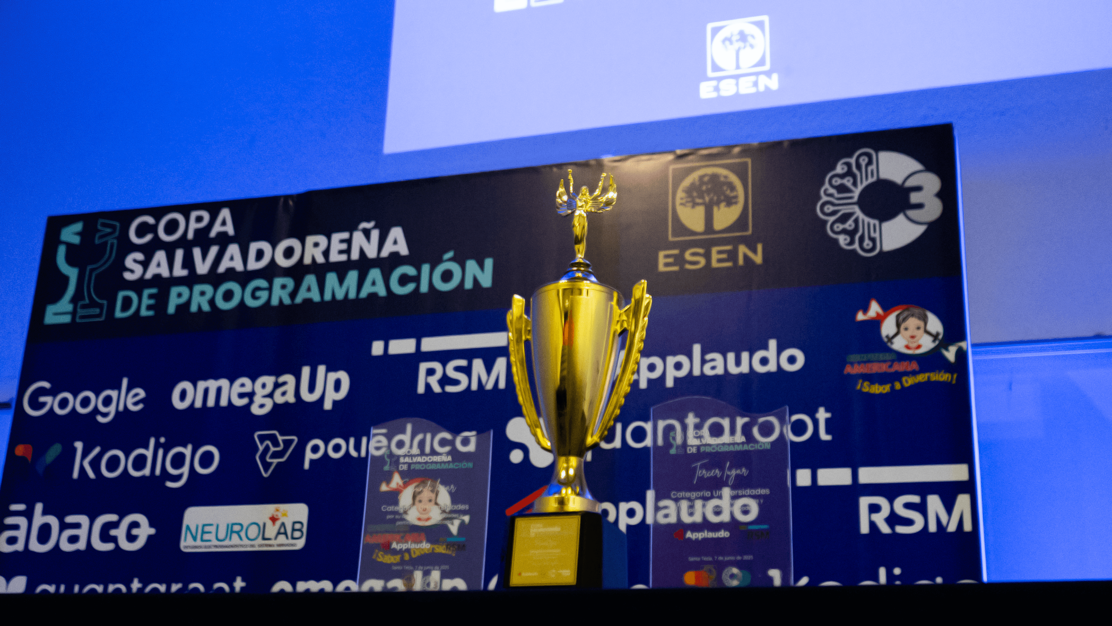 C3 trophy and event backdrop from the Copa Salvadoreña de Programacion